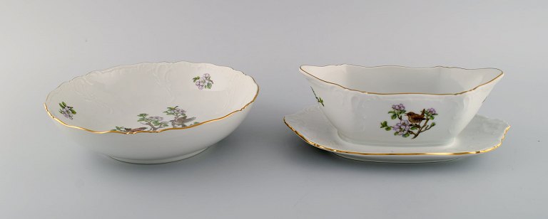 Royal Copenhagen "Spring" sauce boat and bowl in porcelain with motifs of birds 
and foliage. 1980s.
