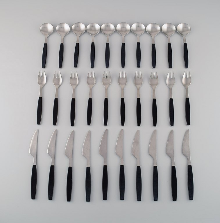 Henning Koppel for Georg Jensen. Strata service for ten people in stainless 
steel and black plastic. 1960s / 70