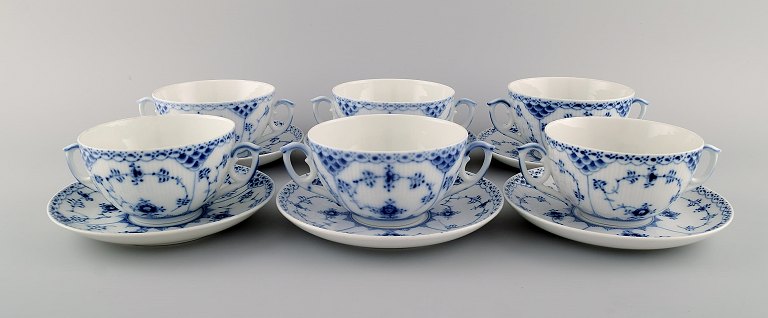 Six Royal Copenhagen Blue Fluted Half Lace boullion cups with saucers in 
porcelain.
