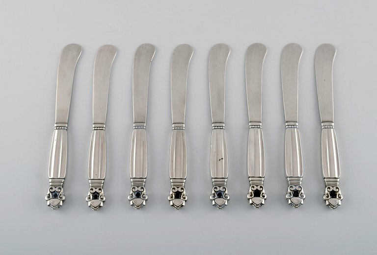 Eight Georg Jensen Acorn butter knives in all sterling silver.
