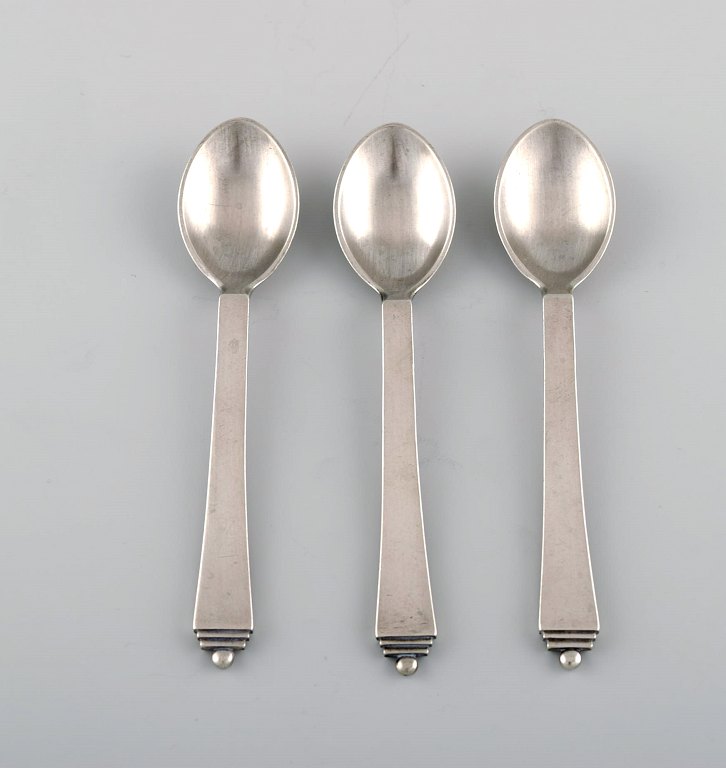 Three Georg Jensen Pyramid coffee spoons in sterling silver.
