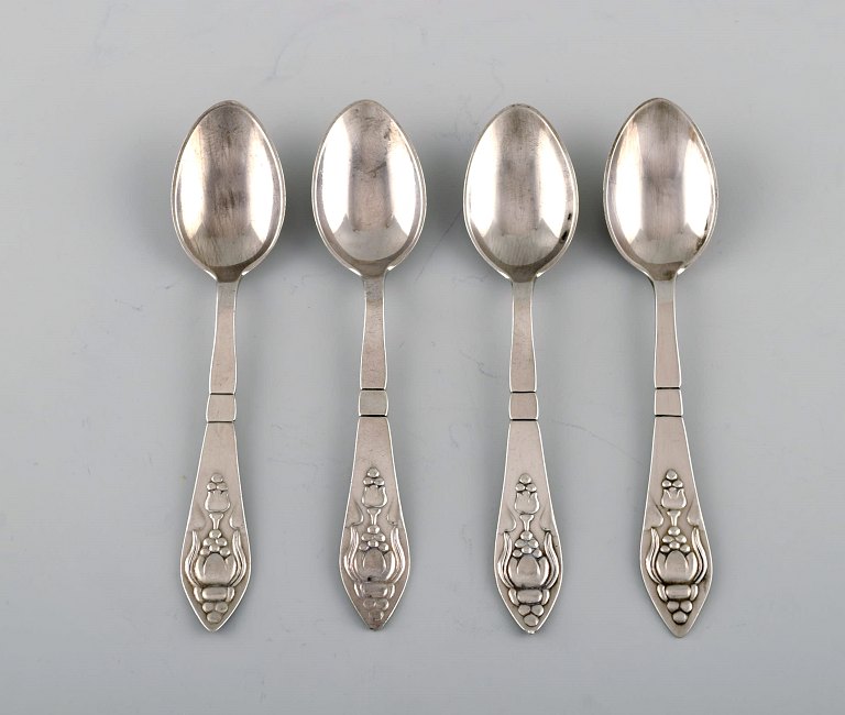 Four rare Georg Jensen Bell coffee spoons in sterling silver.
