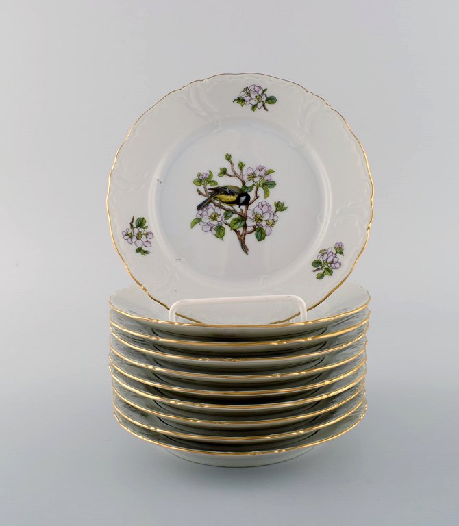10 Royal Copenhagen "Spring" plates in porcelain with motifs of birds and 
foliage. 1980s. Model number: 1533/2519.
