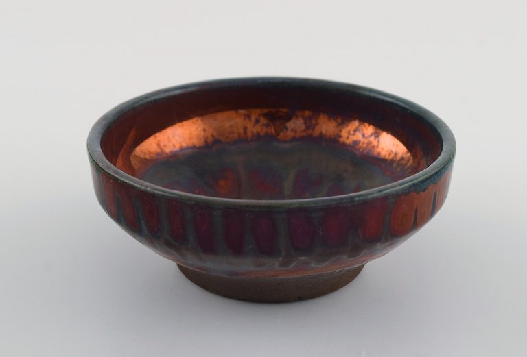 Svaneke, Denmark. Unique bowl in glazed ceramics. Beautiful luster glaze. Ca. 
1980.
