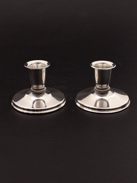 A pair of sterling silver candlesticks