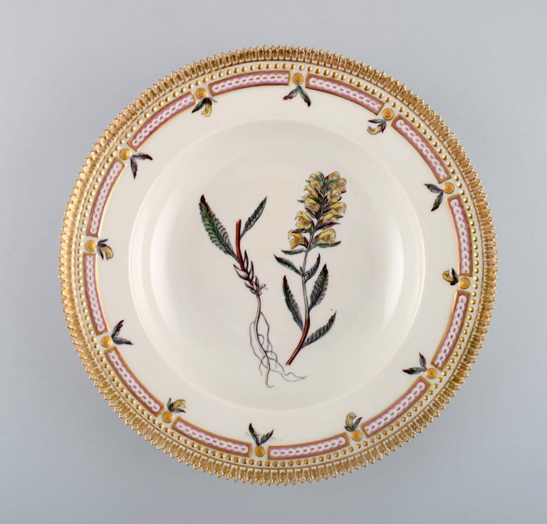 Royal Copenhagen flora danica deep plate in porcelain with hand-painted flowers 
and gold decoration. Early 20th century.
