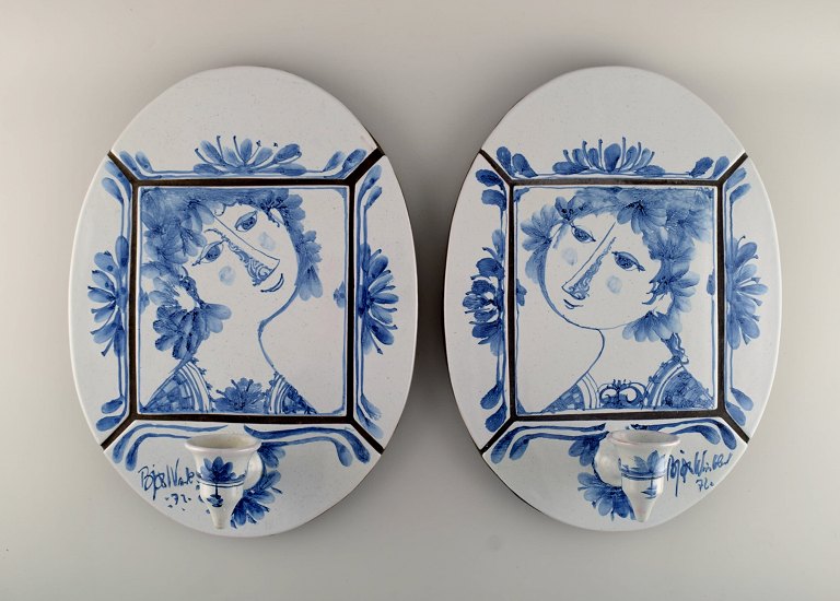 Bjørn Wiinblad (1918-2006), Denmark. A pair of unique wall plaques with candle 
holders in glazed ceramics decorated with women