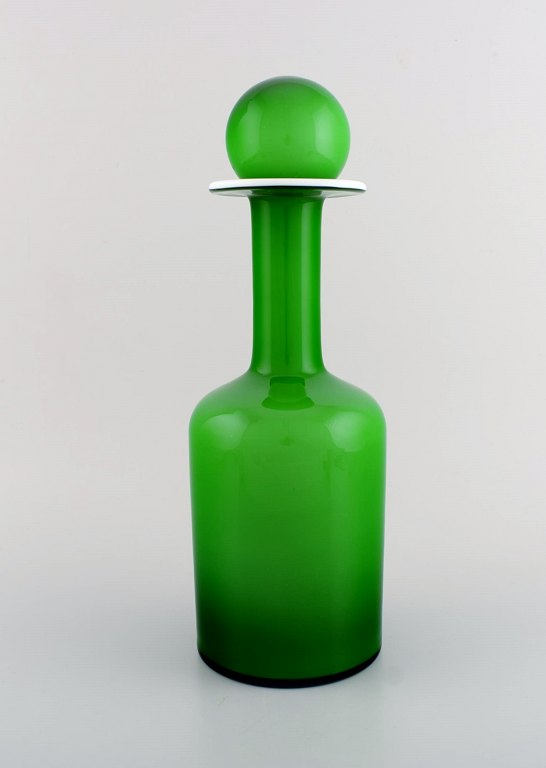 Otto Brauer for Holmegaard. Large rare vase / bottle in light green art glass 
with light green ball. 1960