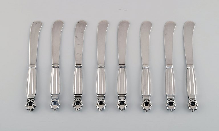 Eight Georg Jensen Acorn butter knives in all sterling silver.
