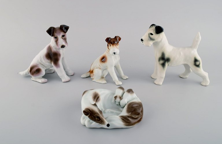 Four German porcelain figurines. Terrier and greyhound with puppies. 1960s.
