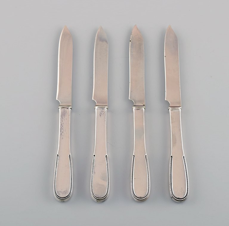 Four Evald Nielsen number 14 fruit knives in hammered silver (830). 1920s.
