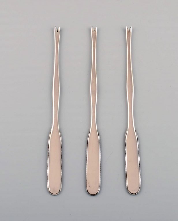 Three Evald Nielsen number 14 lobster forks in hammered silver (830). 1920s.
