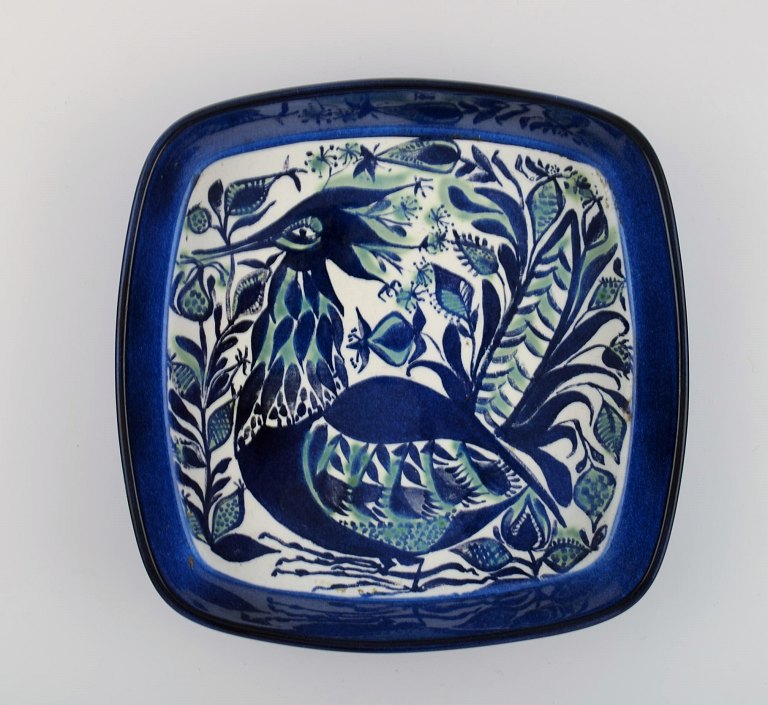 Marianne Johnson for Royal Copenhagen. Dish in hand-painted glazed faience. 
"Blue fantasy bird". Dated 1969-1974.
