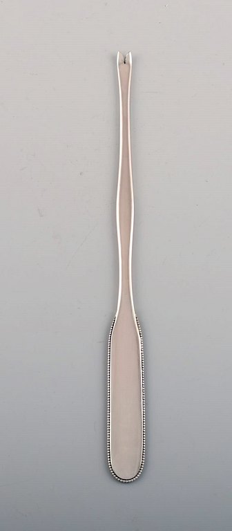 Evald Nielsen number 14 lobster fork in hammered silver (830). 1920s.
