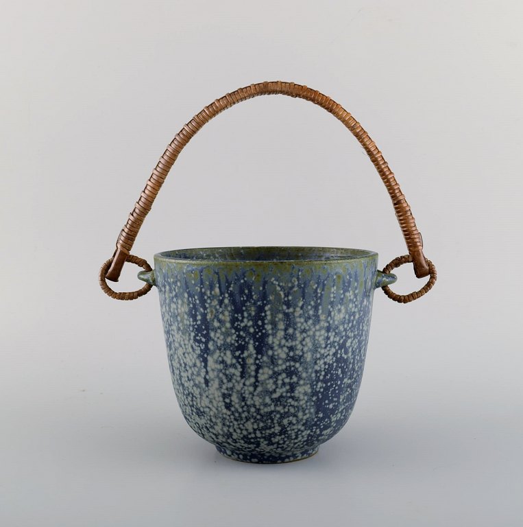 Arne Bang (1901-1983), Denmark. Ice bucket in glazed ceramics with handle in 
wicker. Model number 15. Beautiful glaze in shades of blue. 1940s / 50s.
