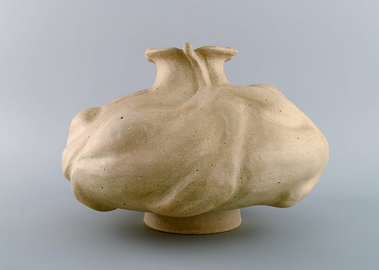 Christina Muff, Danish contemporary ceramicist (b. 1971). Hand modeled 
sculptural vase with flowerbud decoration. This dramatic looking sculptural vase 
stands unglazed. Part of the ‘Seed’ series by Christina Muff. One of a kind. 
