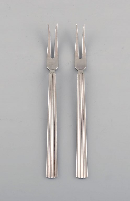Sigvard Bernadotte for Georg Jensen. Two Bernadotte cold meat forks in sterling 
silver.
