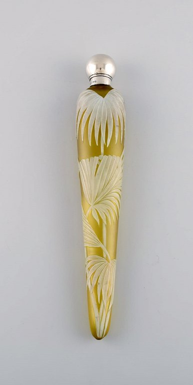 Thomas Webb & Sons, England. Antique art nouveau perfume bottle, mouth blown art 
glass with white cover glass. Decoration in the form of palm leaves and 
butterfly. Ca. 1900
