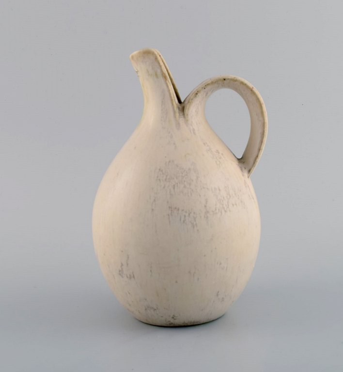 Eva Stæhr-Nielsen for Saxbo. Pitcher in glazed stoneware. Beautiful glaze in 
shades of sand. 1940s.
