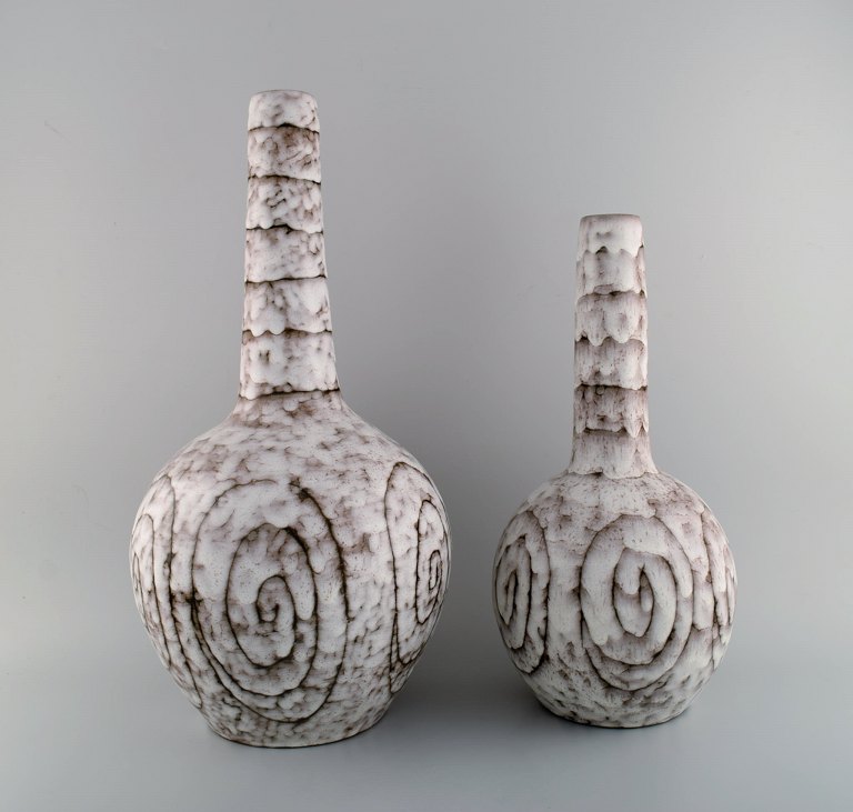 European studio ceramicist. Two narrow-necked floor vases in glazed ceramics. 
1960s / 70s.
