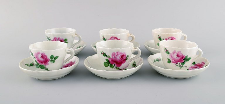 Six antique Meissen coffee cups with saucers in hand-painted porcelain with pink 
roses. Ca. 1900.
