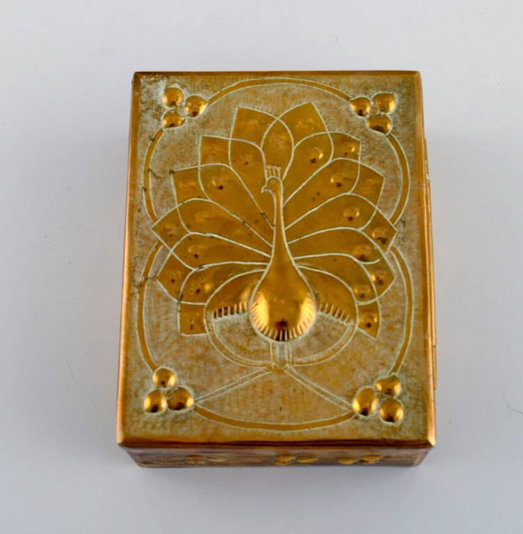 Brass lidded box with peacock. Mid-20th century.
