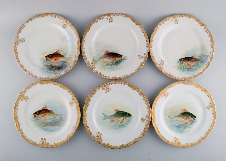 Six antique Pirkenhammer dinner plates in porcelain with hand-painted fish and 
gold decoration. High quality, early 1900s.

