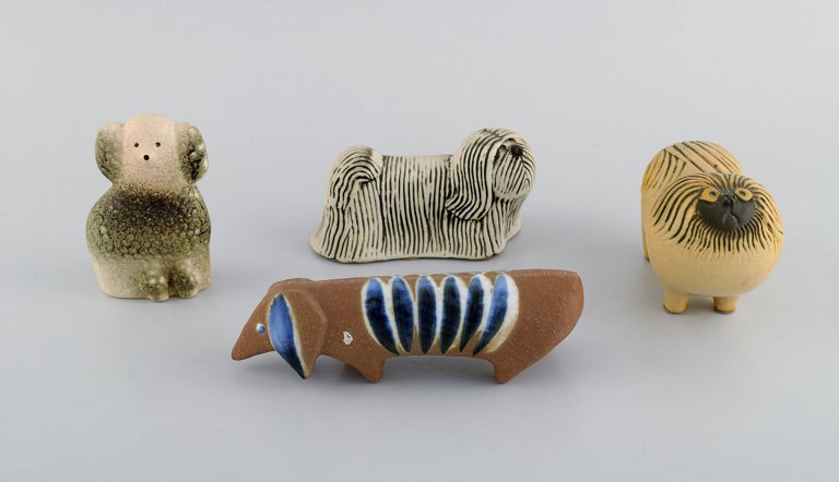 Lisa Larson for Gustavsberg. Four dogs in glazed ceramics. 1970s.
