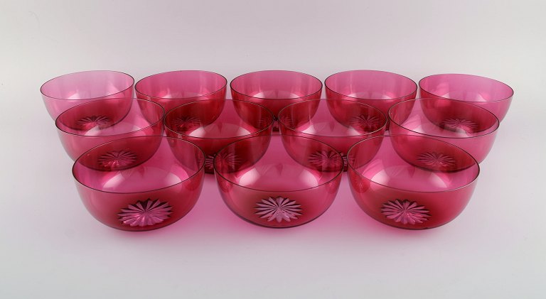 Set of twelve Holmegaard bowls in pink art glass. Danish design, mid-20th 
century.

