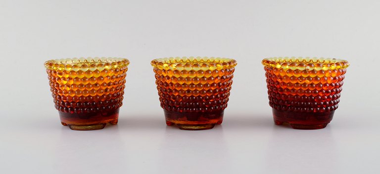 Monica Bratt for Reijmyre. Three Pärlan candlesticks for small candles in mouth 
blown art glass. 1950s.
