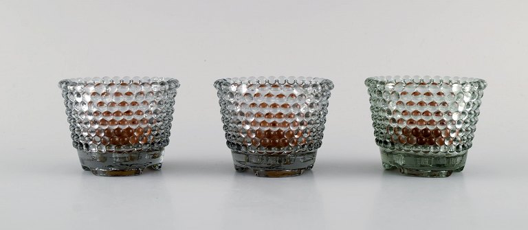 Monica Bratt for Reijmyre. Three Pärlan candlesticks for small candles in mouth 
blown art glass. 1950s.
