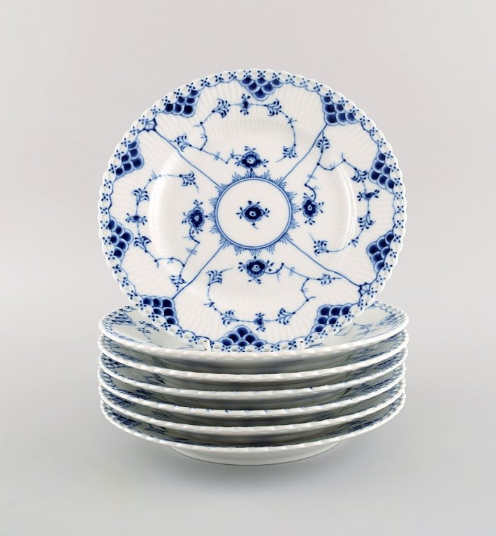 Eight Royal Copenhagen blue fluted full lace plates in openwork porcelain. 
Decoration number: 1/1086.
