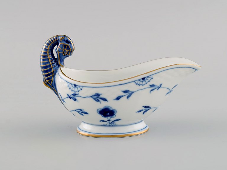 Bing & Grøndahl Blue Fluted sauce boat with hand-painted gold decoration and 
handle in the form of a seahorse. Mid-20th century.
