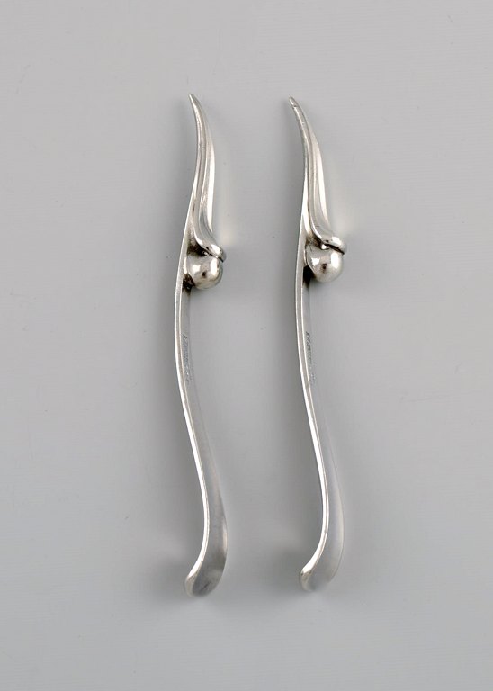 Two Georg Jensen nut / cocktail picks in sterling silver. Ornamental design. 
Model 68B. Dated 1933-44.
