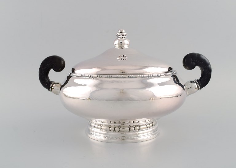 Evald Nielsen (1879-1958), Danish silversmith. Lidded art nouveau  silver tureen 
with handles of horn. Dated 1918.
