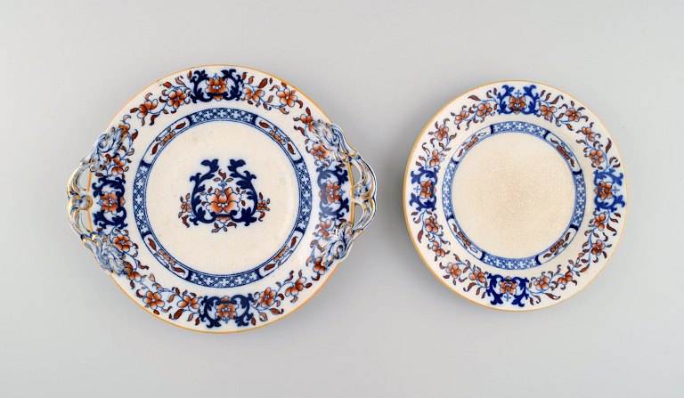 Mintons, England. Two antique plates in hand-painted faience. Chinese style, 
early 20th century.
