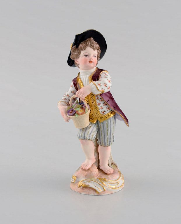 Antique Meissen figure in hand-painted porcelain. Boy with flower basket. 19th 
century.
