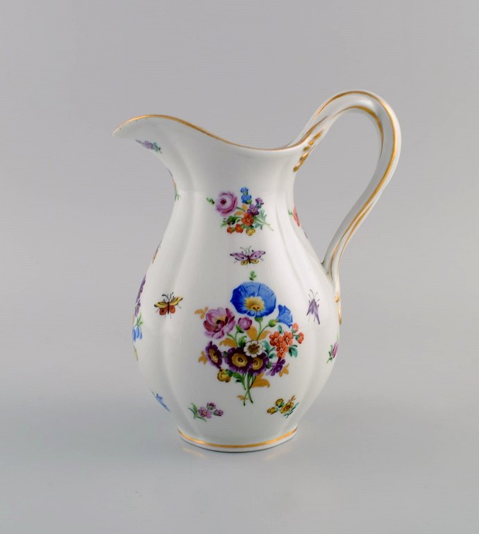 Antique Meissen porcelain jug with hand-painted gold decoration, flowers and 
insects. 19th century.
