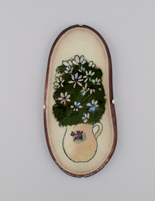 Heljä Liukko-Sundström (b. 1938) for Arabia. Glazed faience wall plaque with 
hand-painted flowers. Finnish design. Dated 1985.
