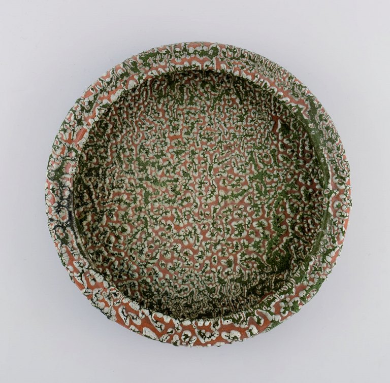 Patrick Nordström (1870-1929). Unique dish / bowl in glazed ceramics. Islev, own 
workshop. Beautiful and unusual speckled glaze. Dated 1928.
