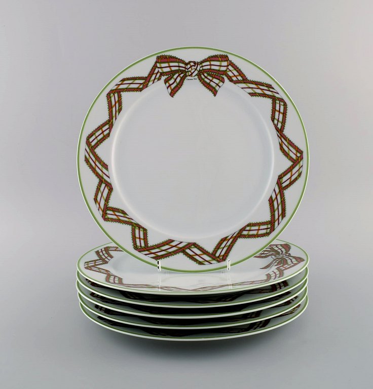 Limoges, France. Six rare Christian Dior "Spring" porcelain dinner plates 
decorated with ribbon and bow. 1980s.
