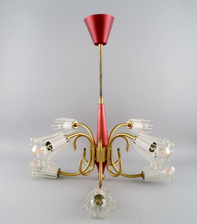 Emil Stejnar for Rupert Nikoll. Rare eight-armed chandelier in pink brushed 
steel and shaped brass. 1960s.
