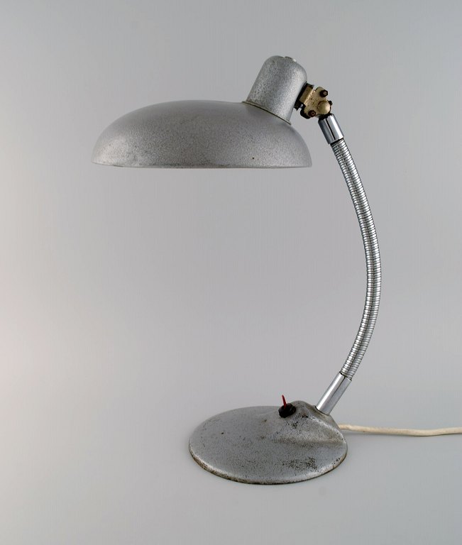 Adjustable desk lamp in original metallic lacquer. Industrial design, mid 20th 
century.
