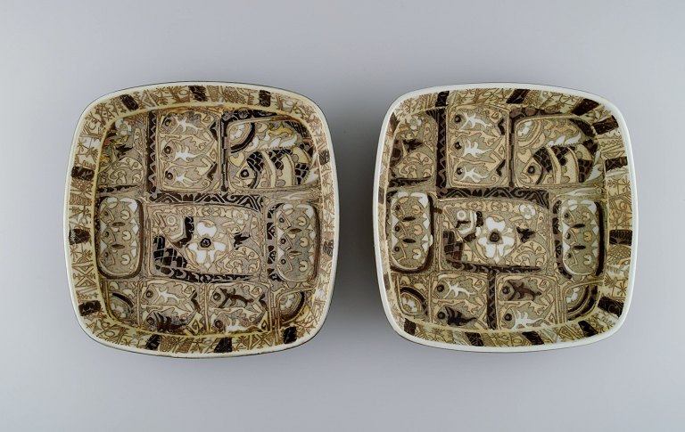 Nils Thorsson and Johanne Gerber for Aluminia, Royal Copenhagen. Two square Baca 
dishes decorated with fish, patterned glaze in sand and light brown shades. 
1960s / 70s.
