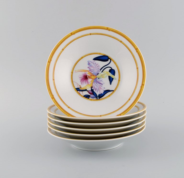 Porcelaine de Paris. "Aurore Tropicale". Six deep porcelain plates decorated 
with flowers and bamboo. 1980s.
