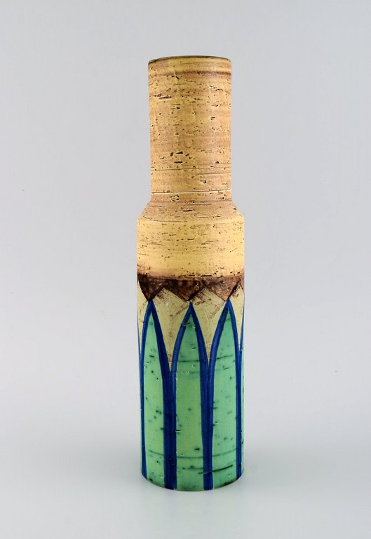 Italian studio ceramicist. Cylindrical vase in glazed stoneware. Hand painted 
green leaves on yellow background. 1960s / 70s.
