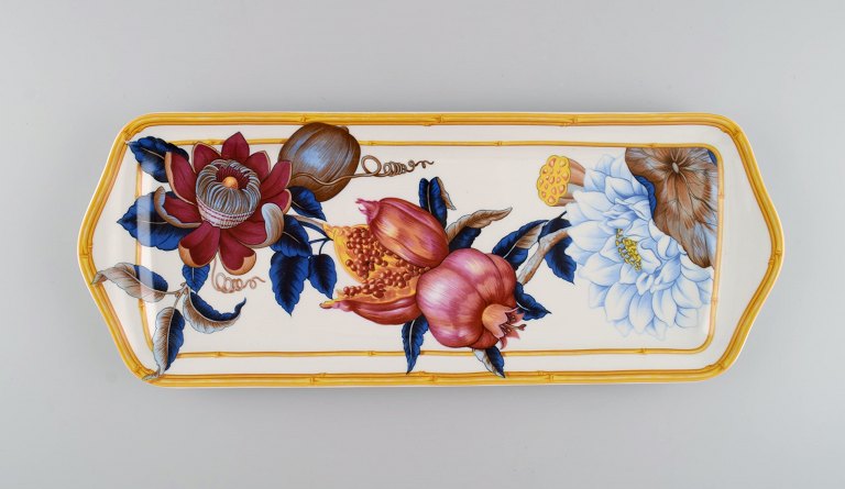 Porcelain of Paris. "Tropical Aurore". Oblong porcelain tray decorated with 
flowers, pomegranates and bamboo. 1980s.
