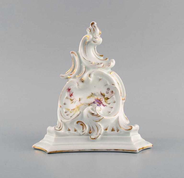 Antique wall console in hand-painted porcelain with flowers and gold decoration. 
Germany, 19th century.
