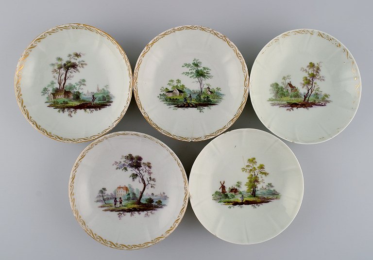 Five antique Royal Copenhagen porcelain bowls with hand-painted landscapes and 
gold decoration. Museum quality. Early 19th century.
