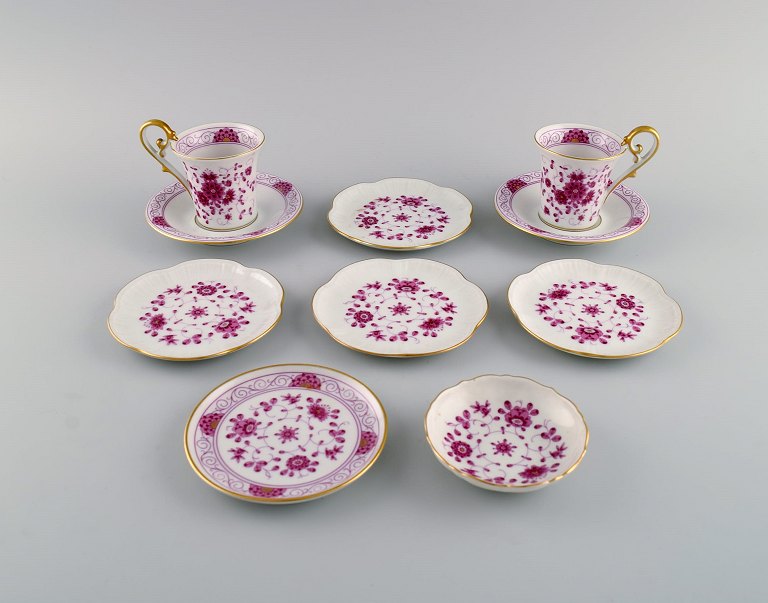Kaiser, Germany. Two coffee cups with saucers and six small bowls in 
hand-painted porcelain with flowers and gold rim. Mid 20th century.
